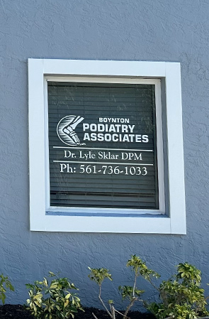 The image shows an exterior sign for Boyntonyton Podiatry Associates and contact information.